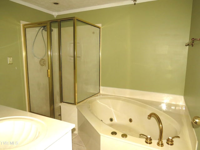 bathroom with ornamental molding, a shower stall, a tub with jets, and vanity