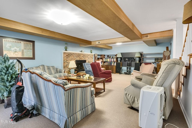 living area with carpet floors, visible vents, beamed ceiling, and a fireplace