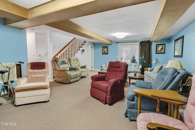 carpeted living area with stairs