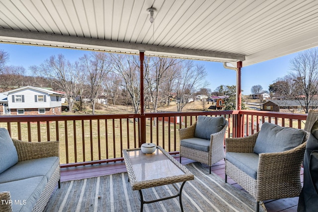 wooden deck featuring a residential view, an outdoor hangout area, and a yard