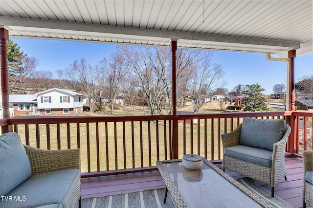 wooden deck with a residential view and a yard