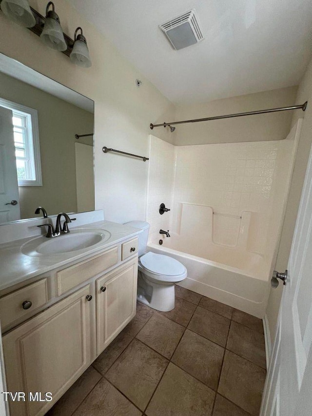 full bath with visible vents, toilet,  shower combination, tile patterned flooring, and vanity