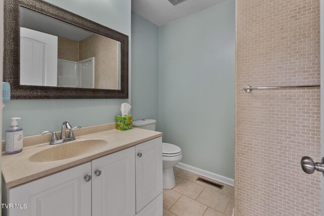 full bathroom with vanity, visible vents, tile patterned flooring, a textured ceiling, and toilet