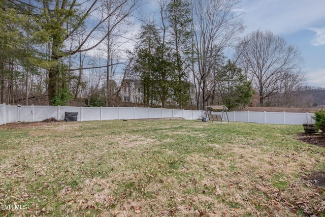 view of yard with a fenced backyard