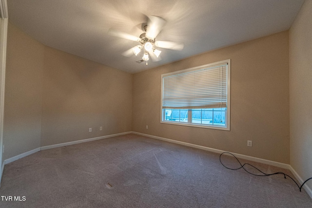 unfurnished room with ceiling fan, carpet flooring, and baseboards