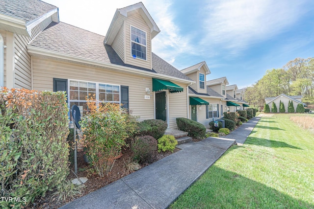 408 Stratford Ct Unit 408, Gray, TN 37615 - view of front of home featuring roof with shingles and a front yard