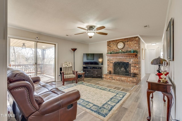1545 Old State Route 34, Telford, TN 37690 - living area with a ceiling fan, ornamental molding, wood finished floors, and visible vents