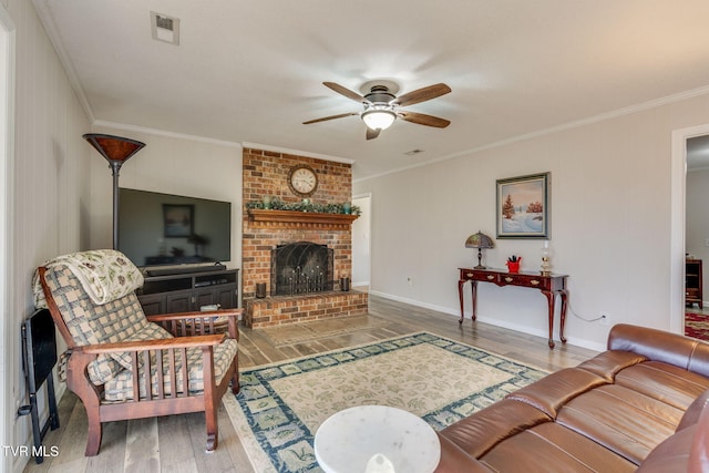 1545 Old State Route 34, Telford, TN 37690 - living area featuring visible vents, crown molding, a fireplace, wood finished floors, and a ceiling fan