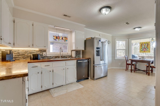 1545 Old State Route 34, Telford, TN 37690 - kitchen with visible vents, white cabinetry, a sink, and stainless steel appliances