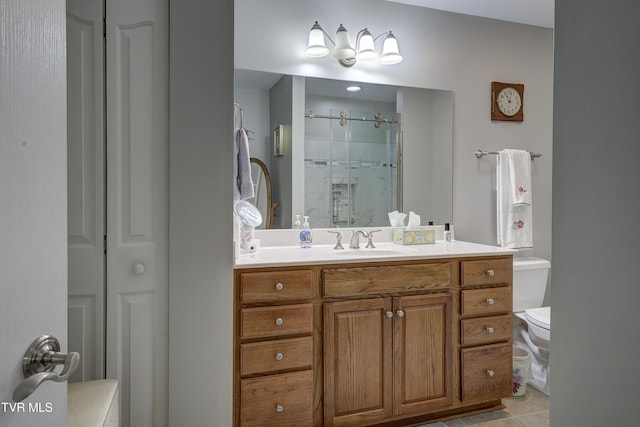 full bathroom with toilet, a stall shower, and vanity