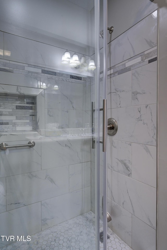 full bath featuring a shower stall