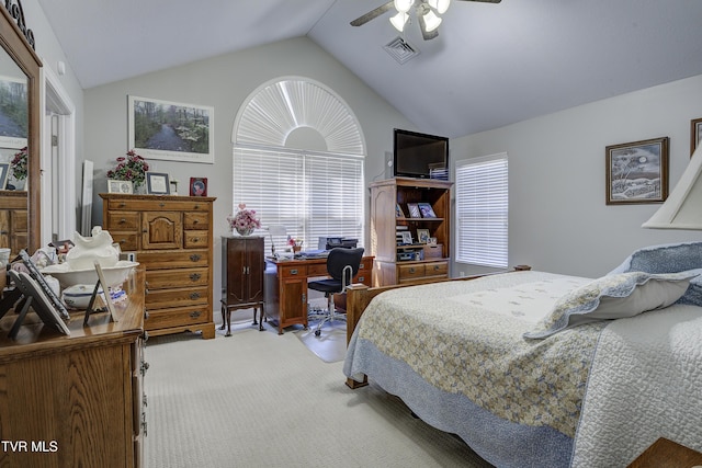 bedroom featuring lofted ceiling, light carpet, visible vents, and a ceiling fan