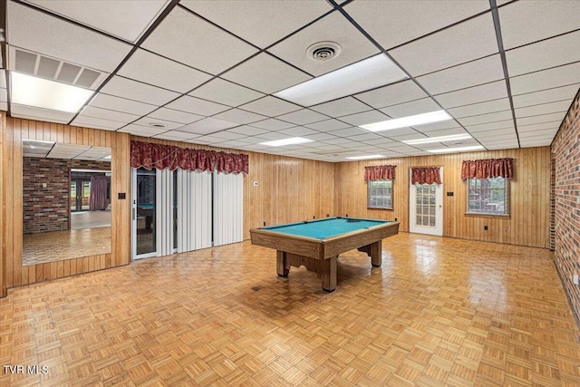 game room featuring visible vents and wooden walls