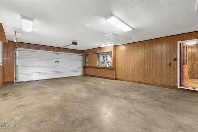 garage featuring wood walls