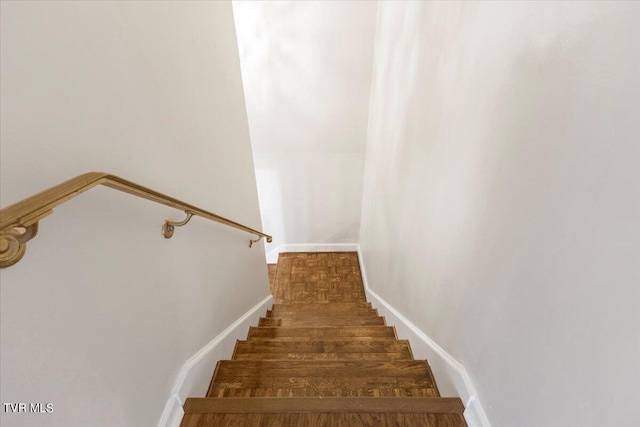 stairway with baseboards