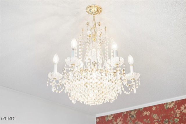 interior details featuring a chandelier