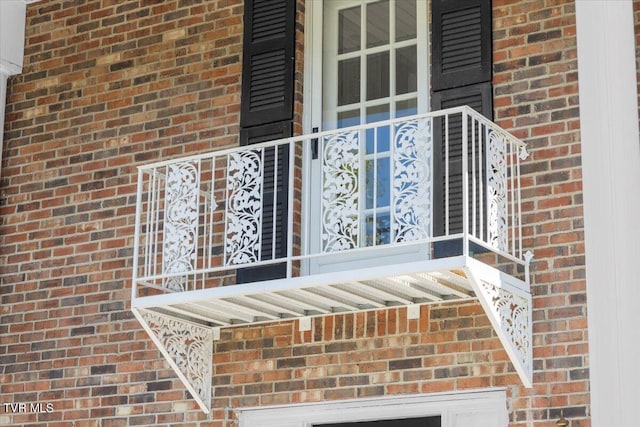 exterior details featuring brick siding