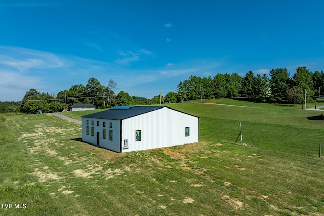 view of pole building with a yard