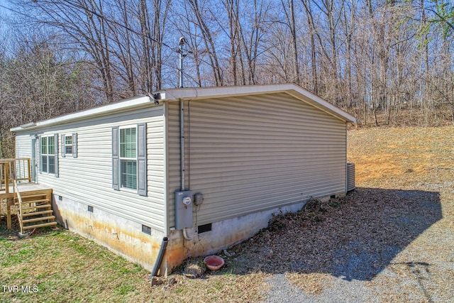 view of home's exterior with crawl space