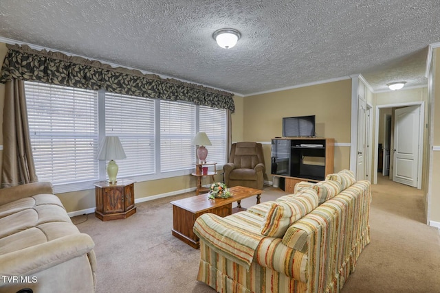living area featuring a healthy amount of sunlight, carpet, baseboards, and crown molding