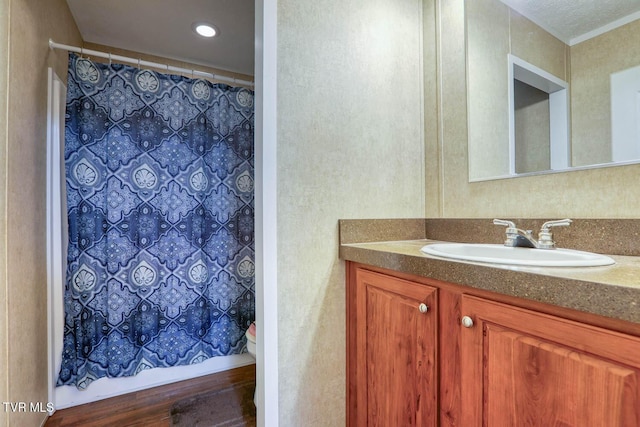 full bath with a shower with curtain, vanity, and toilet