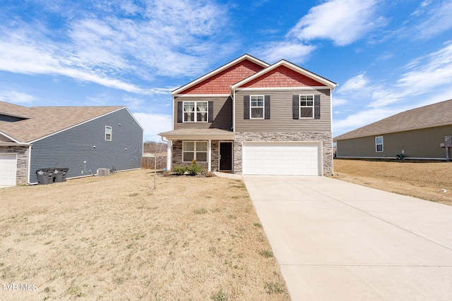 view of front facade with a garage, driveway, central AC, and stone siding