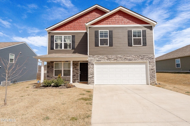 craftsman-style home with a garage, stone siding, and concrete driveway