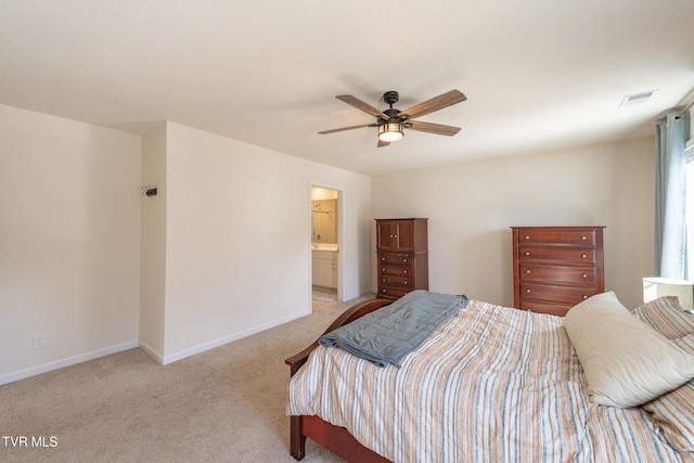 bedroom with visible vents, light carpet, ceiling fan, ensuite bath, and baseboards