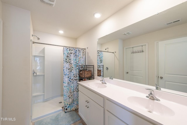 bathroom with a sink, visible vents, and a shower with curtain