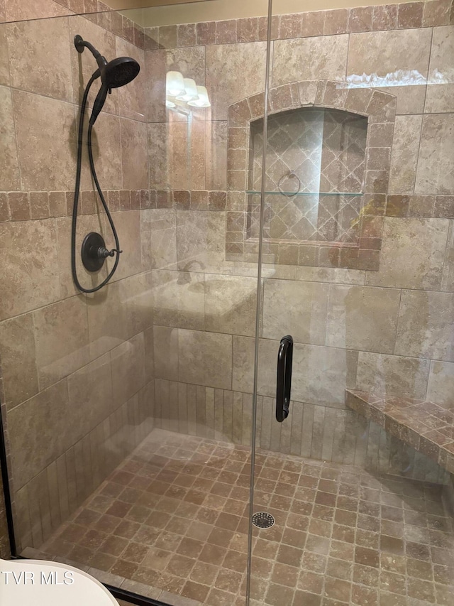 bathroom with a shower stall