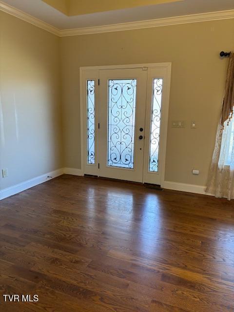 entrance foyer featuring baseboards, dark wood finished floors, and crown molding