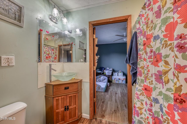 full bath with wood finished floors, vanity, and toilet