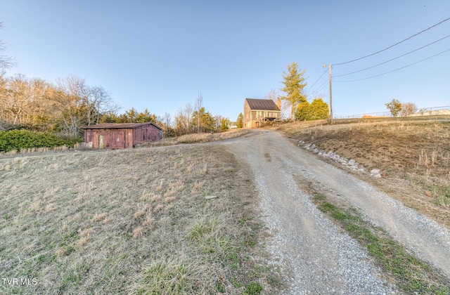 view of road featuring gravel driveway