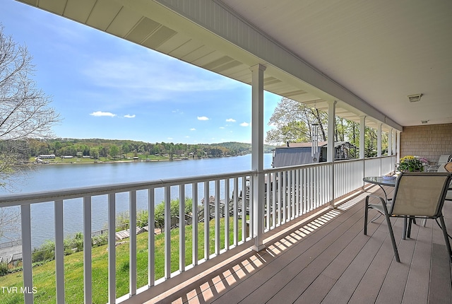 wooden deck with a water view