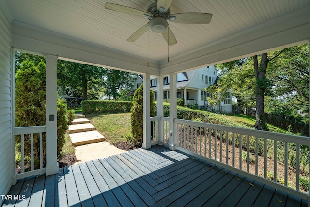 wooden terrace featuring ceiling fan