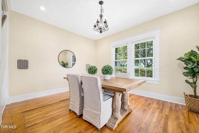 dining room with a chandelier, light wood-type flooring, baseboards, and recessed lighting