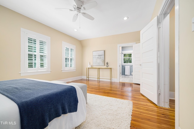 bedroom with light wood-type flooring, ceiling fan, baseboards, and recessed lighting