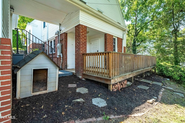 view of side of property featuring brick siding