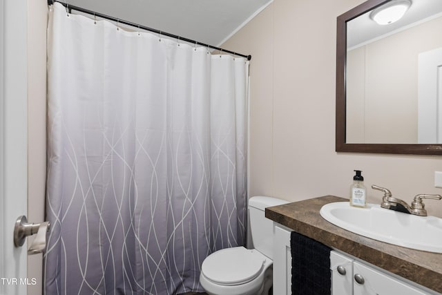 full bathroom with ornamental molding, a shower with curtain, vanity, and toilet