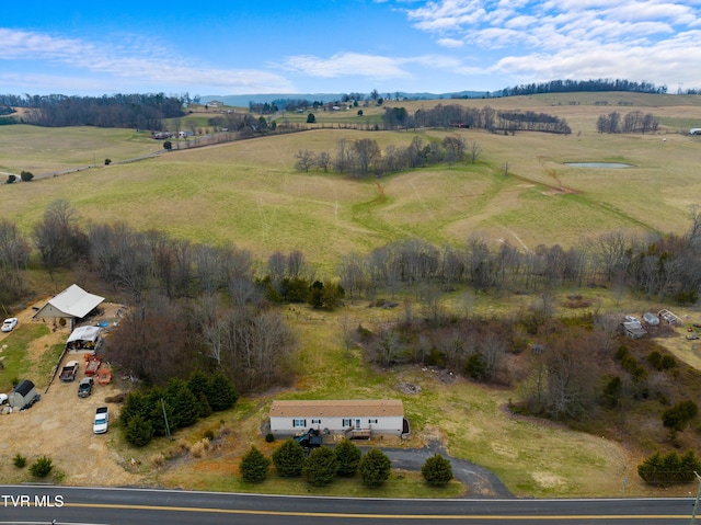 birds eye view of property with a rural view