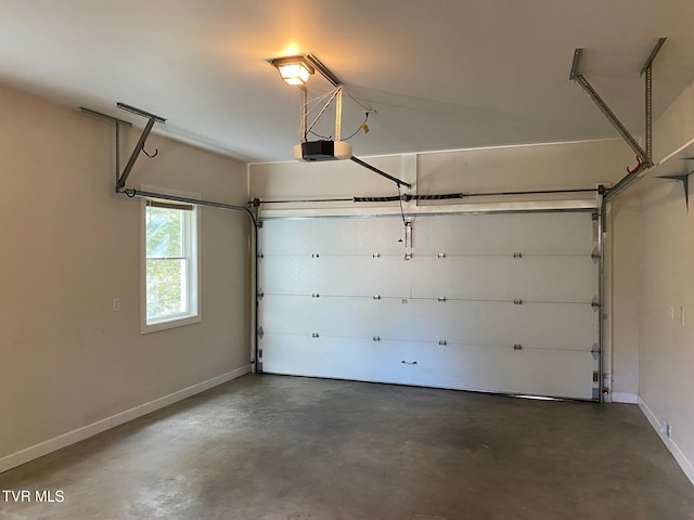 garage featuring baseboards and a garage door opener