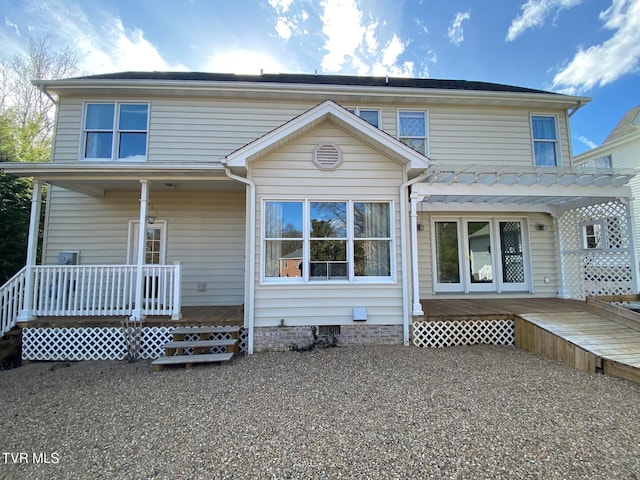 back of property featuring covered porch and crawl space