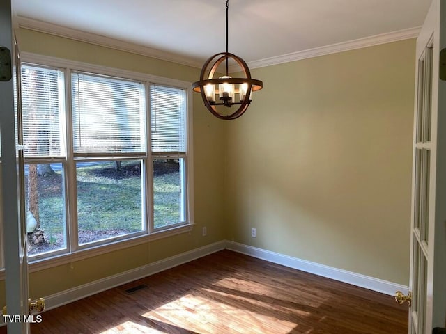 empty room featuring ornamental molding, dark wood-style flooring, visible vents, and baseboards