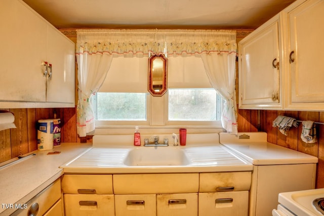 kitchen featuring light countertops, plenty of natural light, and a sink