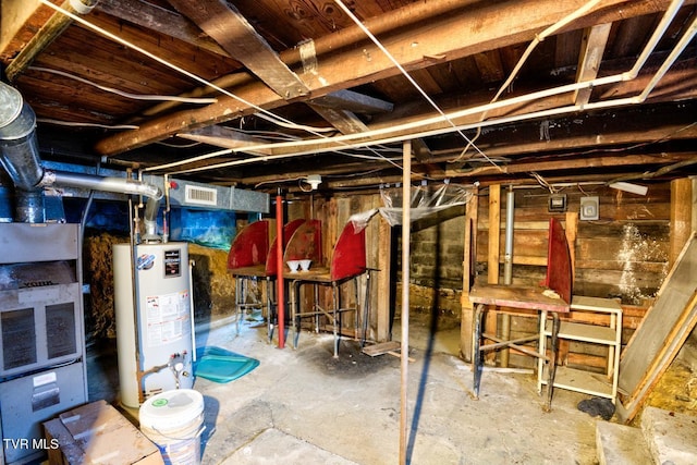 unfinished basement featuring water heater and visible vents