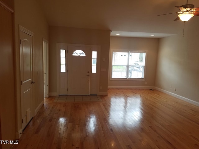 entryway featuring baseboards, ceiling fan, recessed lighting, and light wood-style floors