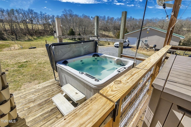 wooden deck featuring an outdoor structure and a hot tub