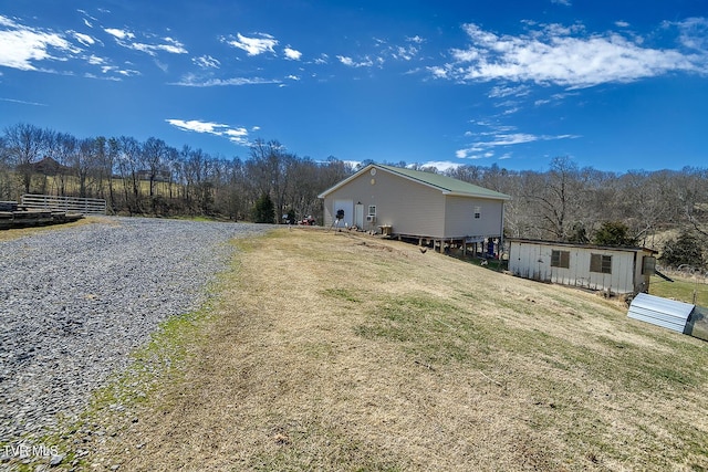 view of side of property with a lawn