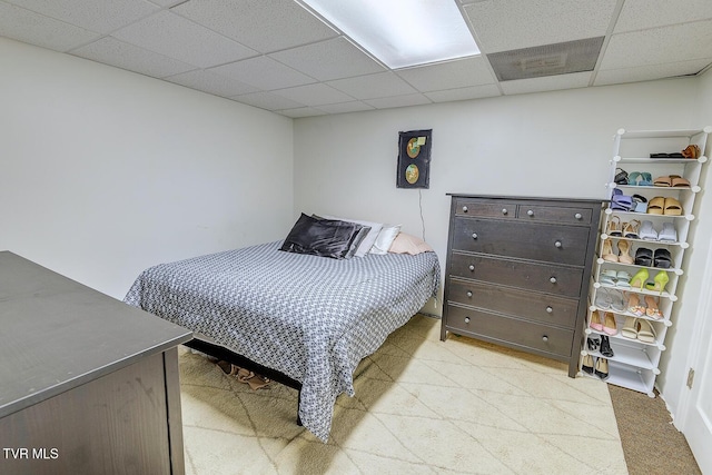 bedroom with a paneled ceiling