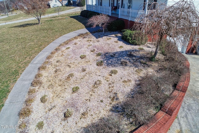 view of yard with covered porch